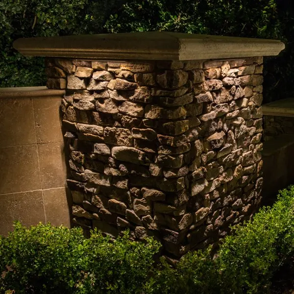 Night stone column pillar with warm wash and cap light, hedges