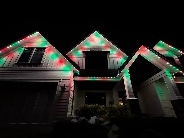 Home gables traced in red-green Christmas color, clean festive nighttime